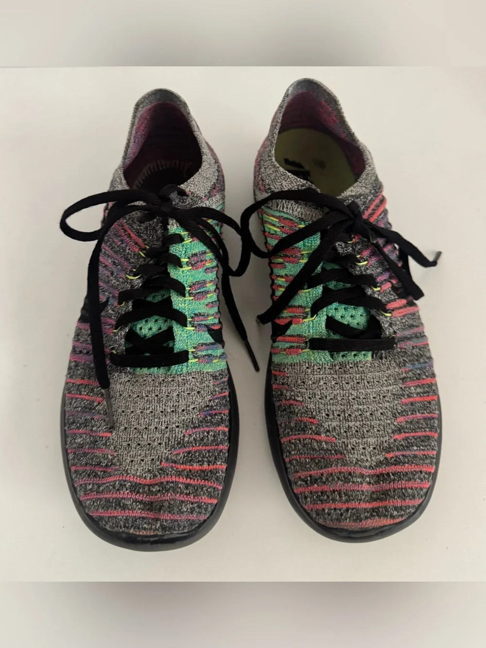 Nike Women’s Gray Knit Running Shoes with Pink and Green Accents